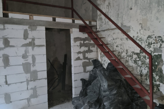Interior after demolition, with the old staircase structure