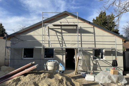 Insulated facade of a residential building before the decorative render was applied