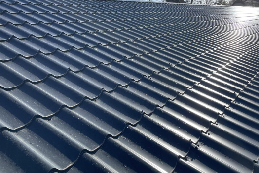 Anthracite sheet metal roofing seen close up