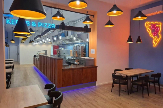 Renovated restaurant dining area with a new counter and lighting